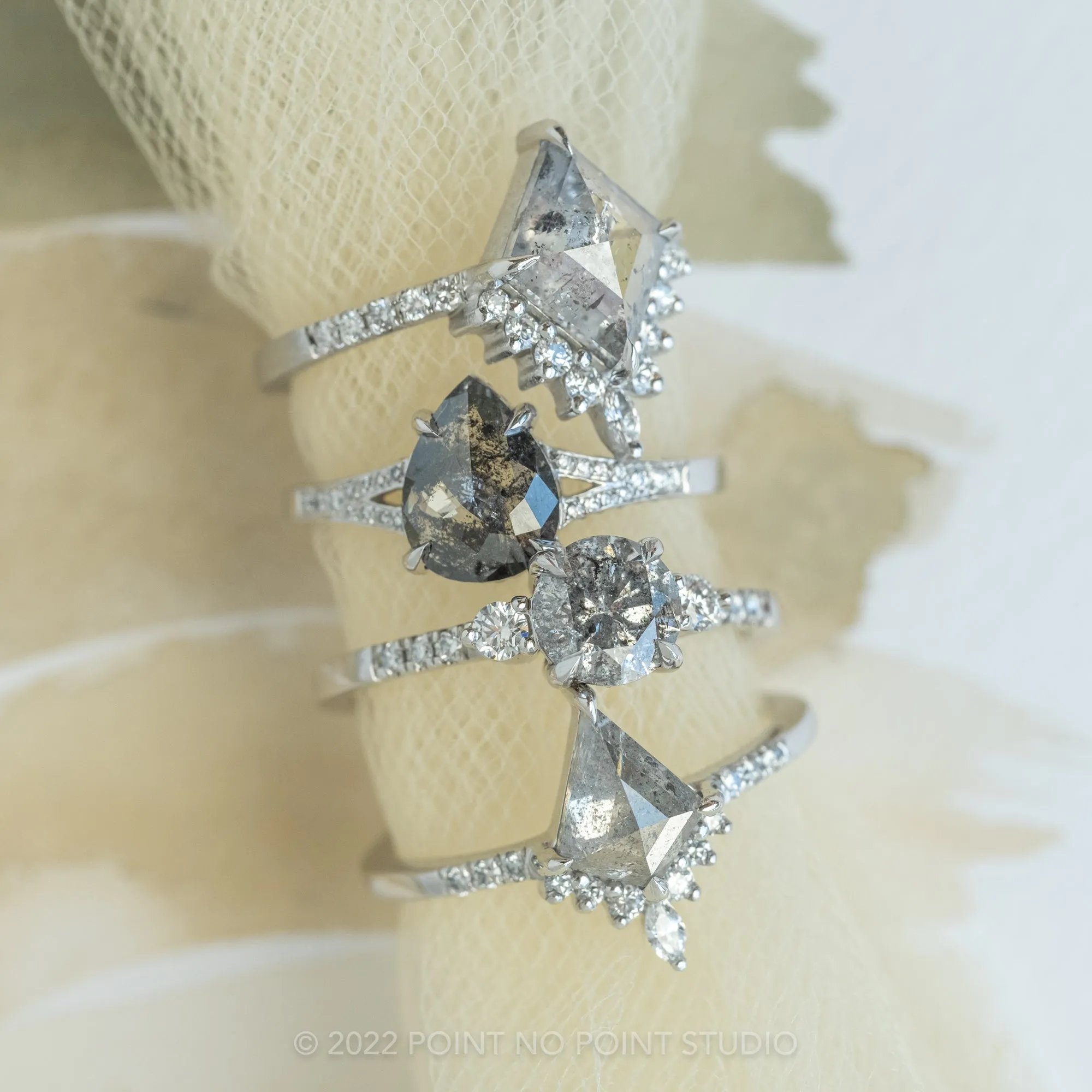 1.56 Carat Black Speckled Pear Diamond Engagement Ring, River Setting, 14K White Gold