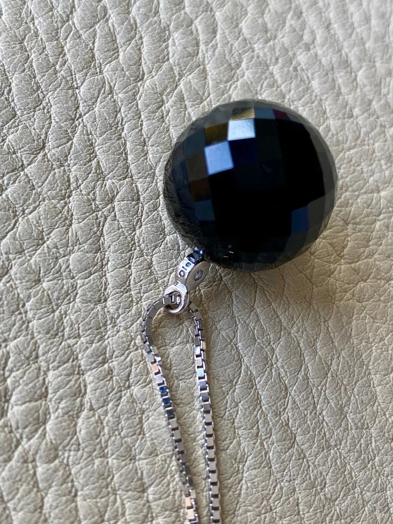 Brilliant! Black onyx faceted orb pendant necklace set in 18k white gold with 0.05 ct brilliant cut diamond by Ole Lynggaard
