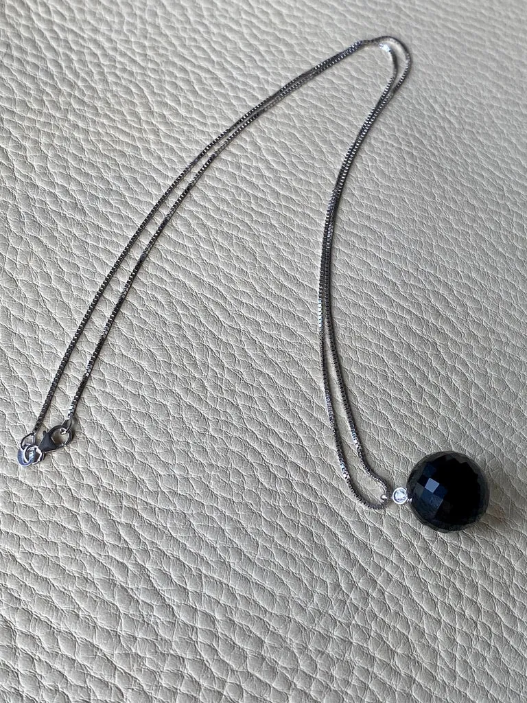 Brilliant! Black onyx faceted orb pendant necklace set in 18k white gold with 0.05 ct brilliant cut diamond by Ole Lynggaard