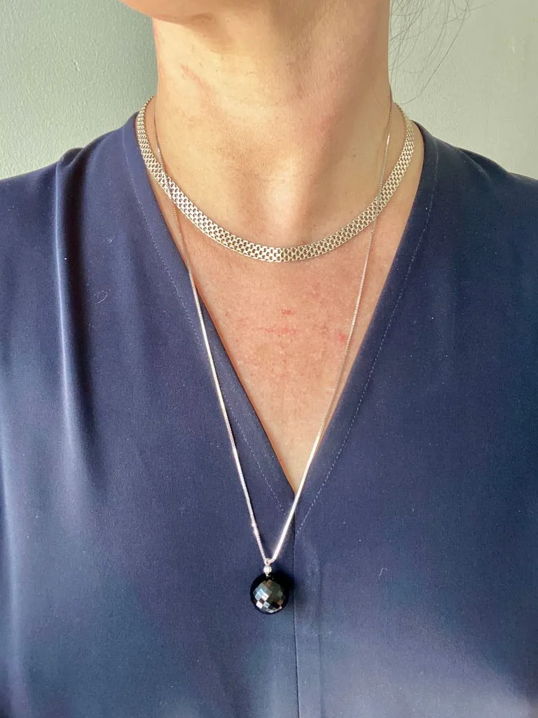 Brilliant! Black onyx faceted orb pendant necklace set in 18k white gold with 0.05 ct brilliant cut diamond by Ole Lynggaard