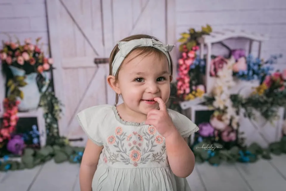 Kate Spring Colorful Flowers Barn Door Backdrop Designed by Megan Leigh Photography