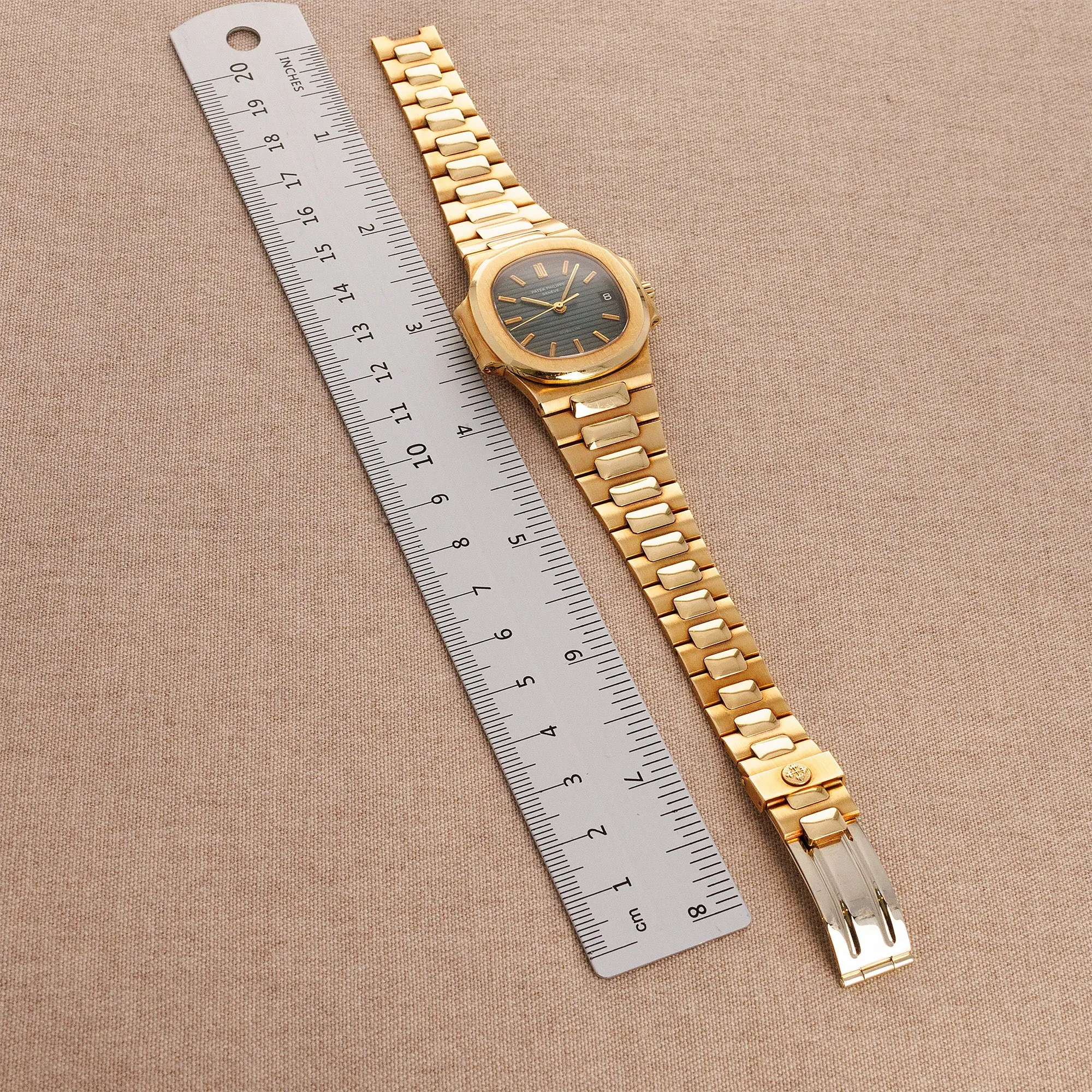 Patek Philippe Yellow Gold Nautilus Watch Ref. 3800 retailed by Gubelin  in Top Condition