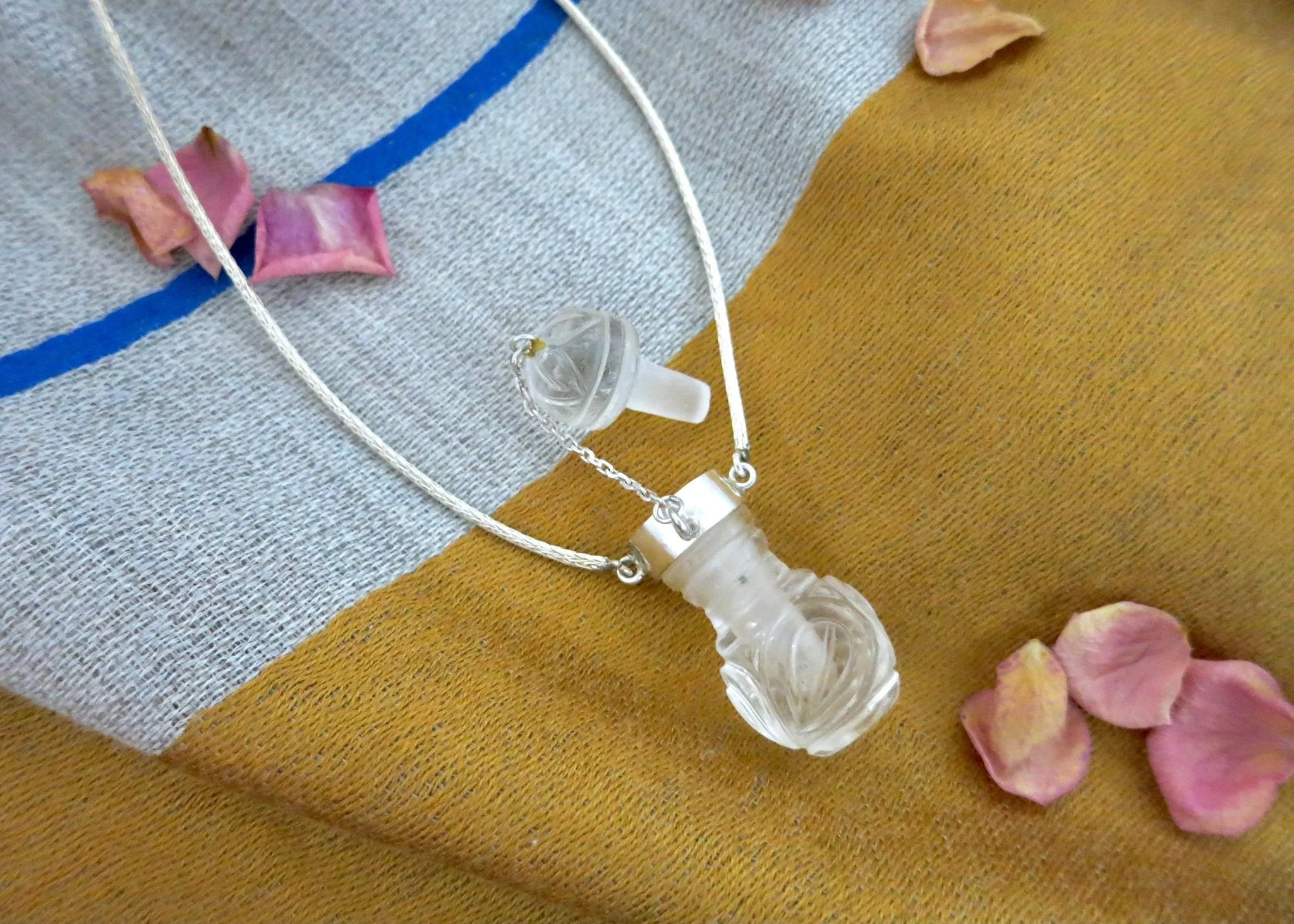 Rare, collectible, hand-carved rock crystal perfume bottle with a handmade chain