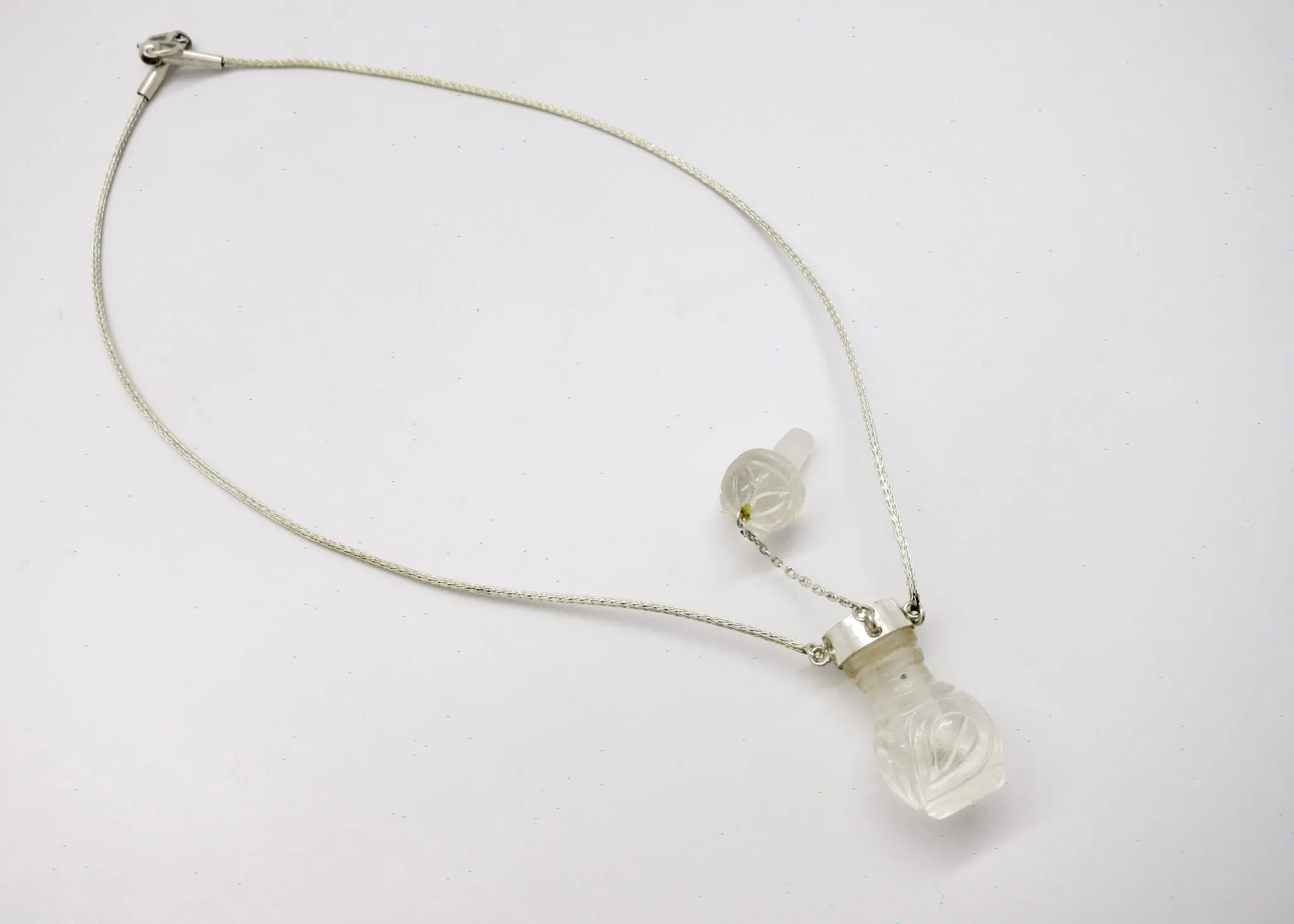 Rare, collectible, hand-carved rock crystal perfume bottle with a handmade chain