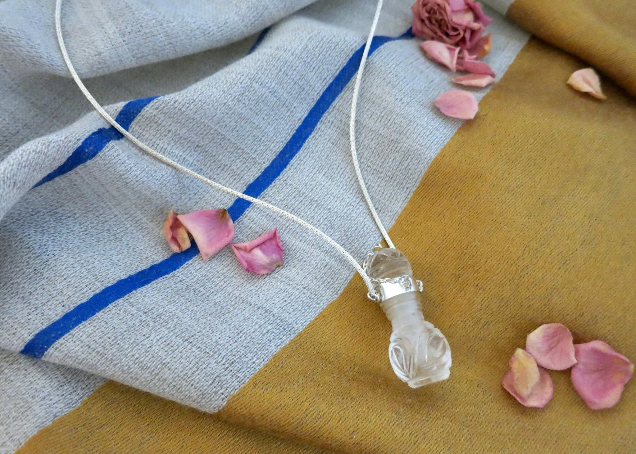 Rare, collectible, hand-carved rock crystal perfume bottle with a handmade chain