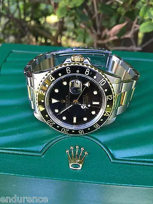 ROLEX GMT II TWO TONE 18k GOLD & STEEL WATCH BLACK 16713