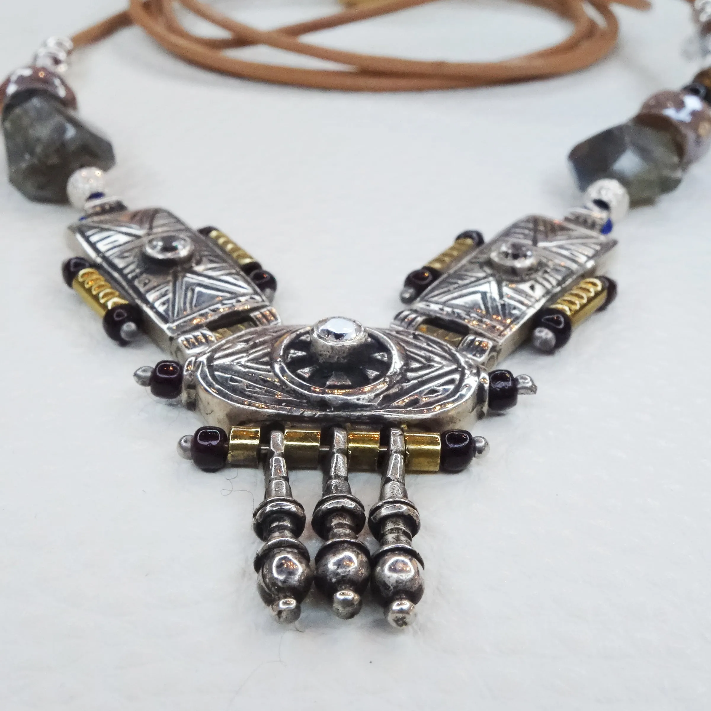 She Stood Her Ground: silver, gold, garnet, and white sapphire necklace