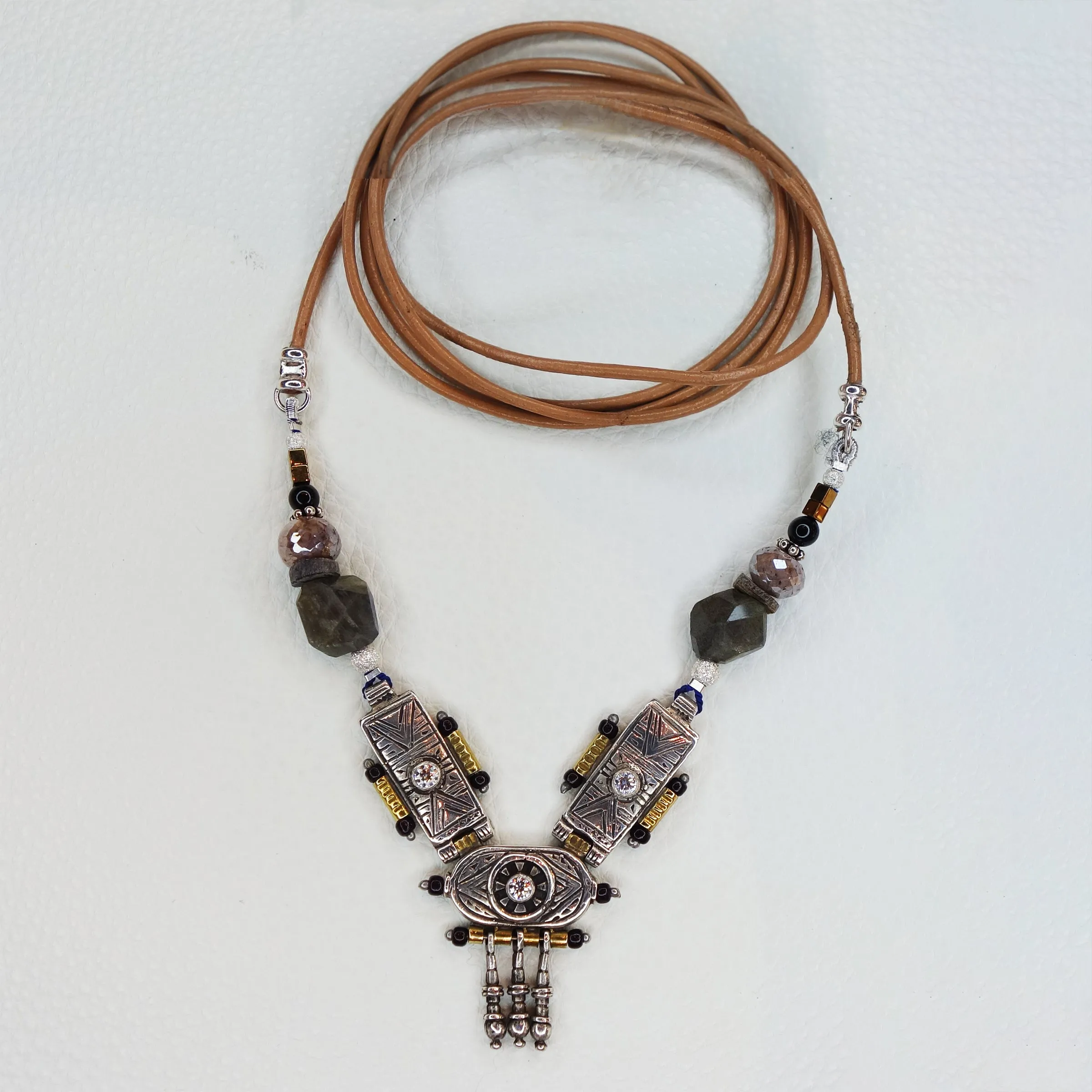 She Stood Her Ground: silver, gold, garnet, and white sapphire necklace