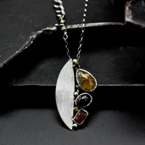 Teardrop Rutilated quartz pendant necklace, orange kyanite and black star diposide with silver semi-oval on sterling silver chain