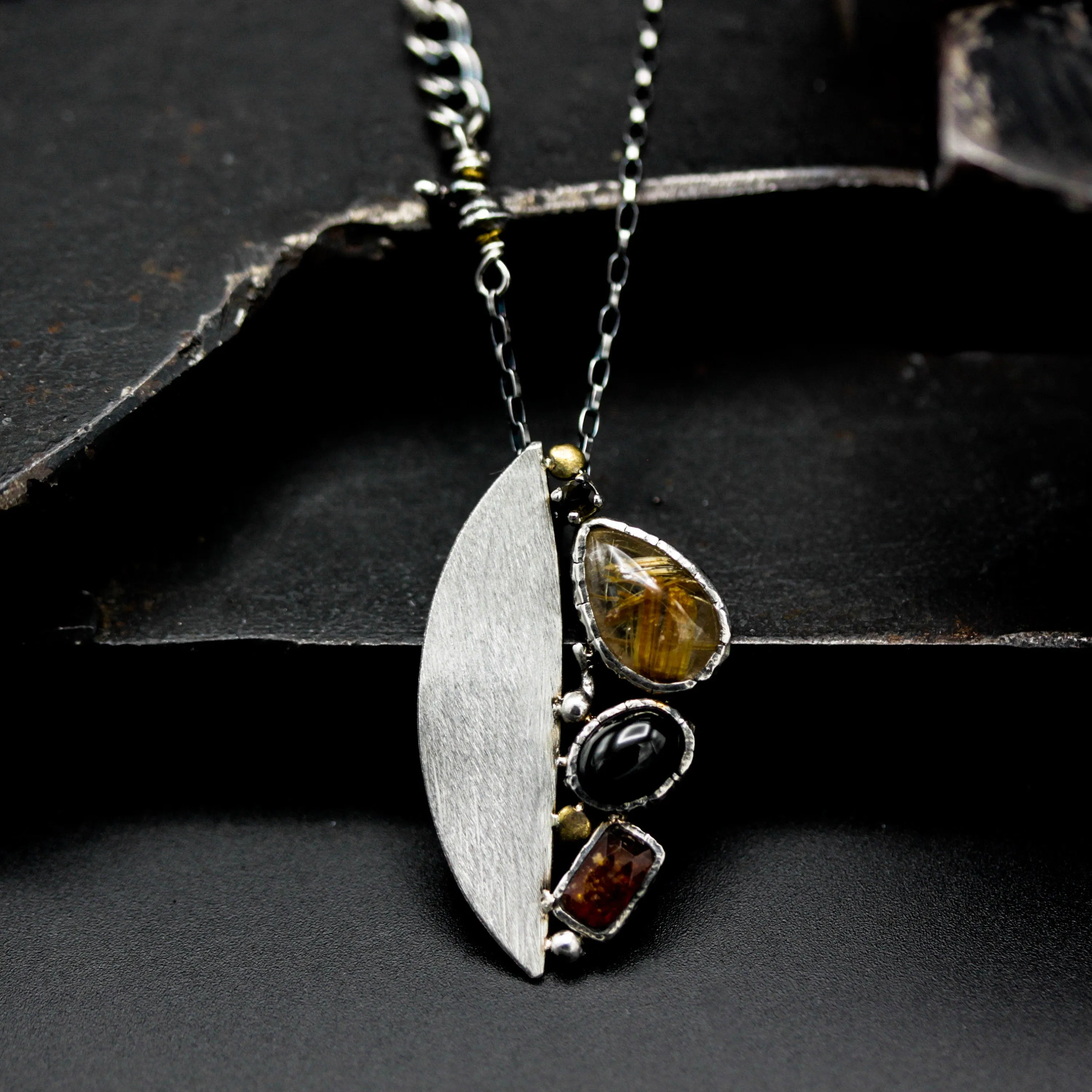 Teardrop Rutilated quartz pendant necklace, orange kyanite and black star diposide with silver semi-oval on sterling silver chain