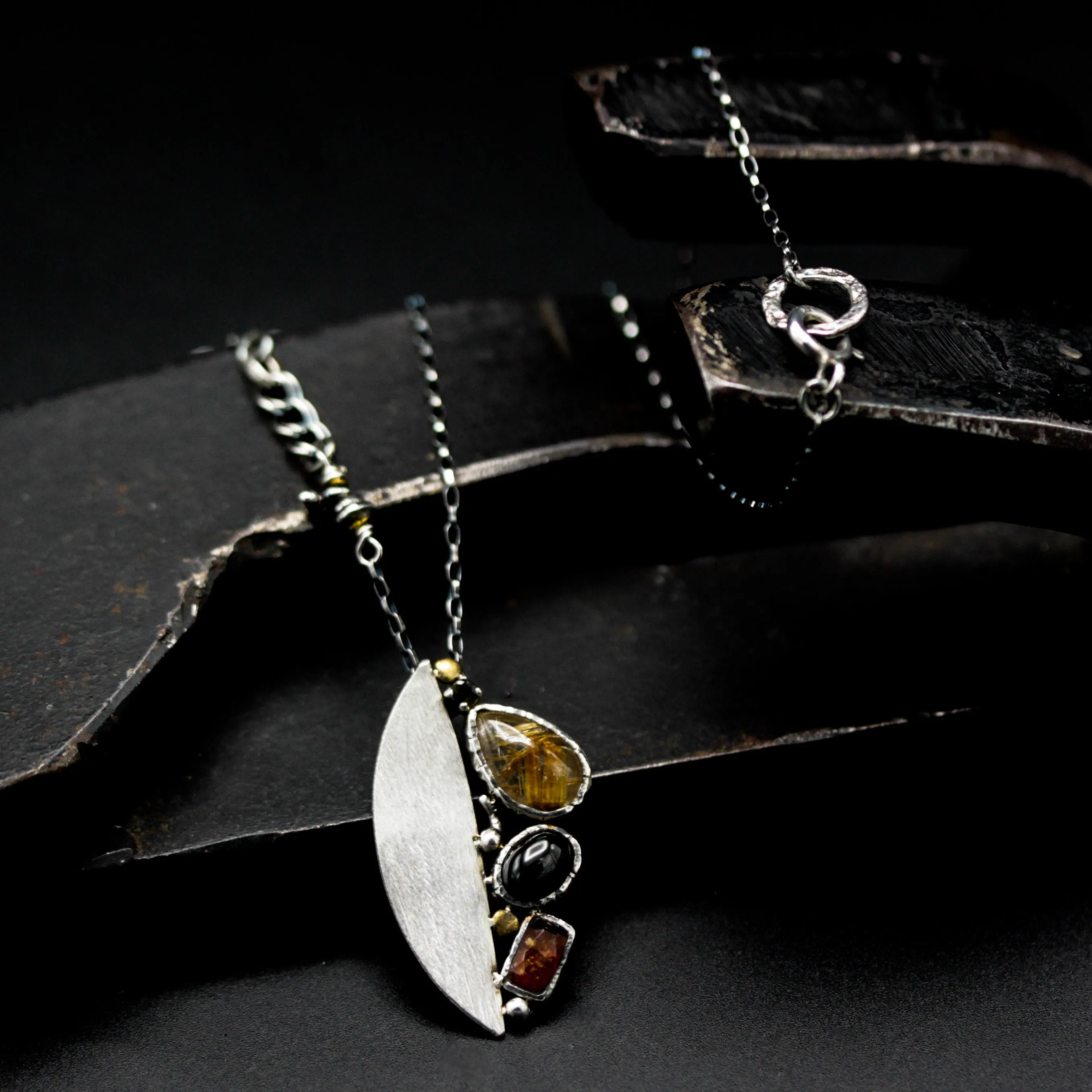 Teardrop Rutilated quartz pendant necklace, orange kyanite and black star diposide with silver semi-oval on sterling silver chain